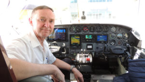 Pilot Brent Bidston sitting in the cockpit of Angel Flight airplane.